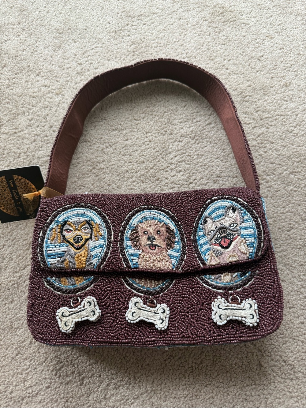 New viral dog lovers beaded bag with bone motifs